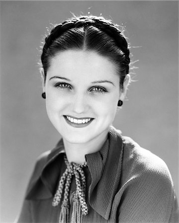 1930s SMILING PRETTY BRUNETTE WOMAN PORTRAIT HAIR BRAIDED LOOKING AT CAMERA Stock Photo - Rights-Managed, Code: 846-08512693