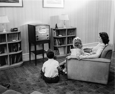 1940s 1950s MOTHER BOY GIRL WATCHING TELEVISION IN FAMILY LIVING ROOM Stock Photo - Rights-Managed, Code: 846-08512740