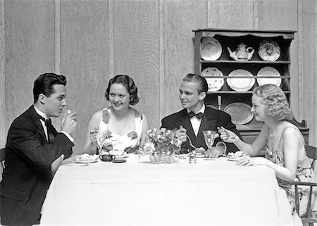 simsearch:846-02791806,k - 1930s TWO COUPLES FOUR MEN AND WOMEN SEATED AT DINING TABLE WEARING FORMAL CLOTHES Stock Photo - Rights-Managed, Code: 846-08639493