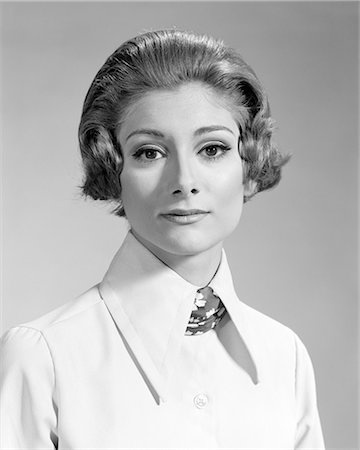 1960s 1970s PORTRAIT SERIOUS WOMAN LOOKING AT CAMERA WEARING BLOUSE WITH BIG COLLAR AND SCARF Stock Photo - Rights-Managed, Code: 846-08639518