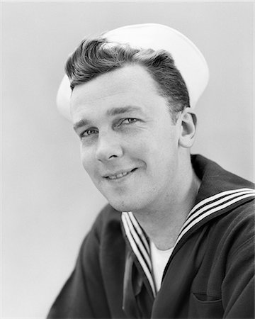 1940s SMILING PORTRAIT AMERICAN SAILOR WEARING NAVY UNIFORM LOOKING AT CAMERA Stock Photo - Rights-Managed, Code: 846-08639558