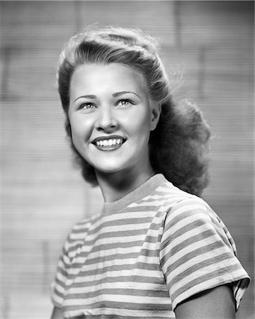 1950s FRESH FACED SMILING TEENAGE WOMAN LOOKING AT CAMERA STRIPED BLOUSE HAIR SLIGHTLY WIND BLOWN Stock Photo - Rights-Managed, Code: 846-09012758