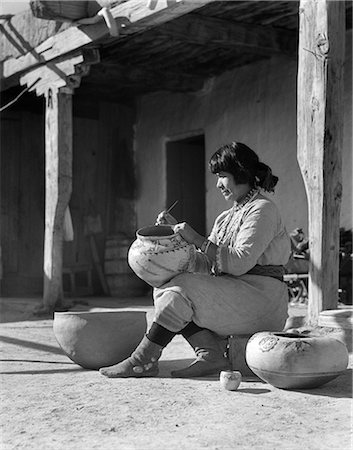 1930s NATIVE AMERICAN INDIAN WOMAN DECORATING POTTERY COCHITI PUEBLO NEW MEXICO USA Stock Photo - Rights-Managed, Code: 846-09012779