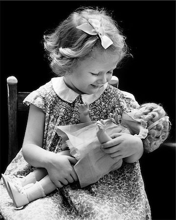 dolly - 1930s 1940s SMILING BLOND GIRL HOLDING BABY DOLL Stock Photo - Rights-Managed, Code: 846-09012797