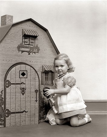 1940s LITTLE GIRL PLAYING DOLL DOLLHOUSE Stock Photo - Rights-Managed, Code: 846-09012804
