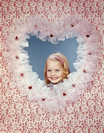 1960s SMILING BLONDE GIRL INSIDE LACY VALENTINES HEART Stock Photo - Rights-Managed, Code: 846-09013044