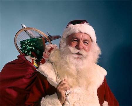 simsearch:846-05647602,k - 1960s PORTRAIT OF SMILING SANTA CLAUS LOOKING AT CAMERA BAG OF TOYS SHOULDER Stock Photo - Rights-Managed, Code: 846-09013057
