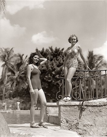 retro usa - 1930s 1940s 2 WOMEN BATHING SUIT SWIM WEAR FASHION STANDING TROPICAL POOL SIDE CORAL GABLES FLORIDA USA Stock Photo - Rights-Managed, Code: 846-09013108