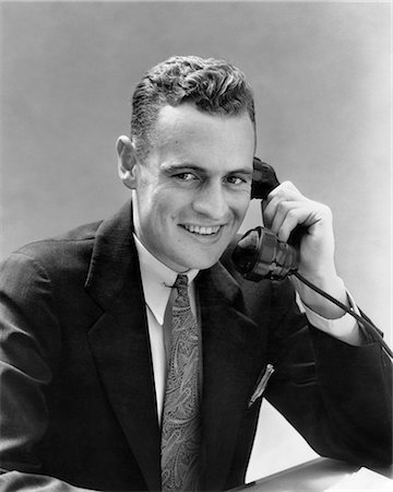 simsearch:846-05648290,k - 1930s MAN TALKING ON TELEPHONE LOOKING AT CAMERA Stock Photo - Rights-Managed, Code: 846-09013139