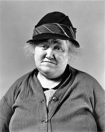 1930s DEPRESSION ERA SENIOR WOMAN SAD FACIAL EXPRESSION WEARING SWEATER AND HAT LOOKING AT CAMERA Stock Photo - Rights-Managed, Code: 846-09085264