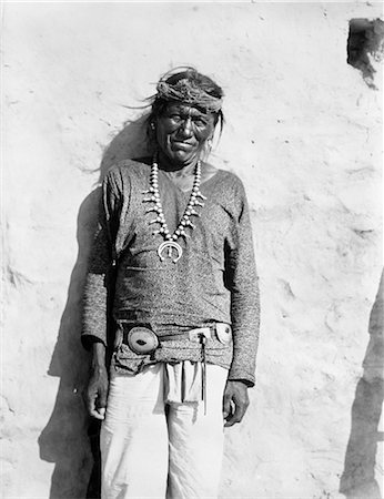 1890 1890s PORTRAIT NATIVE AMERICAN HOPI INDIAN MAN SMILING WEARING SQUASH BLOSSOM NECKLACE LOOKING AT CAMERA Stock Photo - Rights-Managed, Code: 846-09085388