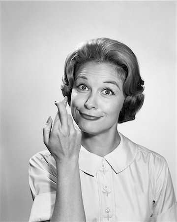 1960s WOMAN FUNNY FACIAL EXPRESSION WITH FINGERS CROSSED FOR LUCK LOOKING AT CAMERA Stock Photo - Rights-Managed, Code: 846-09161432