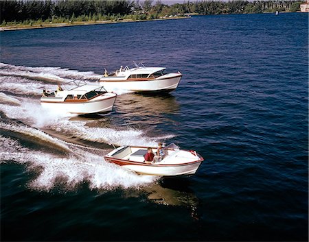 1950s 1960s THREE VINTAGE SMALL WOOD HULL INBOARD POWER BOATS RACING ON WATER Stock Photo - Rights-Managed, Code: 846-09161455