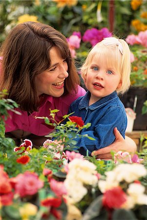 1990s SMILING MOTHER IN THE GARDEN WITH ARM AROUND BLOND DAUGHTER LOOKING AT CAMERA Stock Photo - Rights-Managed, Code: 846-09161485