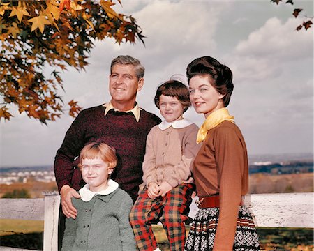 simsearch:846-09012864,k - 1960s FAMILY PORTRAIT OUTDOORS AUTUMN STANDING BY WHITE FENCE Stock Photo - Rights-Managed, Code: 846-09161486