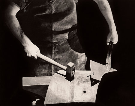 simsearch:846-02792220,k - 1935s CLOSE-UP ANONYMOUS SILHOUETTED BLACKSMITH HANDS WORKING METAL ON ANVIL WITH HAMMER Stock Photo - Rights-Managed, Code: 846-09181661
