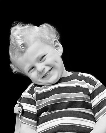 simsearch:846-08030391,k - 1940s PORTRAIT OF SMILING BOY WITH BLOND CURLY HAIR HEAD COCKED TO SIDE WEARING STRIPED TEE-SHIRT LOOKING AT CAMERA Stock Photo - Rights-Managed, Code: 846-09181709