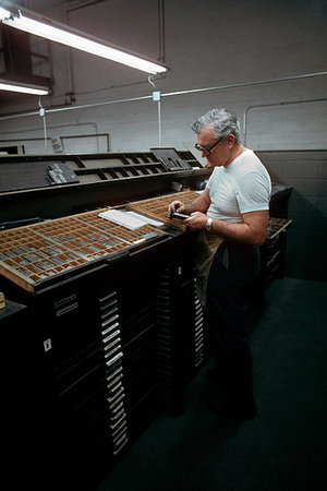 simsearch:846-05646032,k - 1960s MAN TYPESETTER SETTING PRINTING TYPE BY HAND FROM TYPE FONT DRAWER CABINET Stock Photo - Rights-Managed, Code: 846-09181805