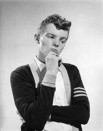 1950s THOUGHTFUL THINKING TEEN BOY WEARING VARSITY SWEATER Stock Photo - Rights-Managed, Code: 846-09181936