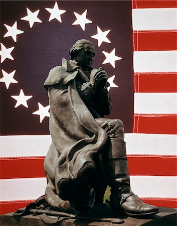 1970s COMPOSITE OF COLONIAL 1776 AMERICAN FLAG BEHIND STATUE OF GEORGE WASHINGTON Stock Photo - Rights-Managed, Code: 846-02794398