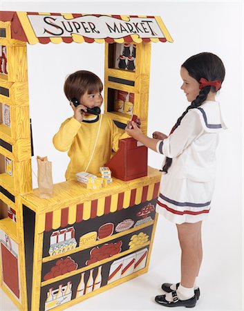 1970s TOY GROCERY STORE BOY AS GROCER CASHIER GIRL AS CUSTOMER Stock Photo - Rights-Managed, Code: 846-02794527