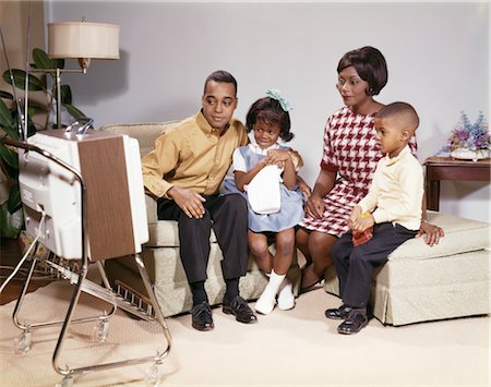 father and son vintage - 1960s FAMILY AFRICAN AMERICAN FAMILY FATHER MOTHER SON DAUGHTER IN LIVING ROOM WATCHING PORTABLE TELEVISION TV SET Stock Photo - Rights-Managed, Code: 846-02794888