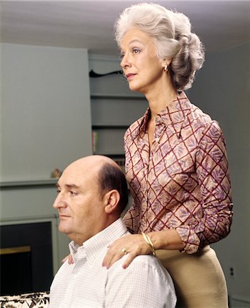 1970s PROFILE PORTRAIT OF SERIOUS SENIOR COUPLE MAN SITTING WOMAN STANDING Stock Photo - Rights-Managed, Code: 846-02795087