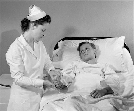 simsearch:846-05647696,k - 1940s CHILD BOY NURSE SICK PULSE BED HOSPITAL Stock Photo - Rights-Managed, Code: 846-02795423