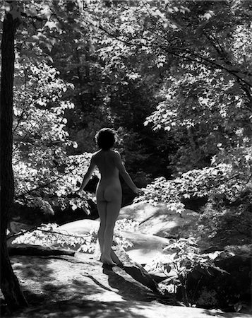 1920s 1930s REAR VIEW NUDE WOMAN FULL LENGTH FROM BEHIND IN WOODLAND FOREST NATURE SCENE Stock Photo - Rights-Managed, Code: 846-02795681