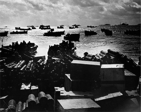 1940s WORLD WAR II DAWN DUSK COAST GUARD LANDING CRAFT CROWDING SHALLOW INVASION WATERS SOLDIERS Stock Photo - Rights-Managed, Code: 846-02795723