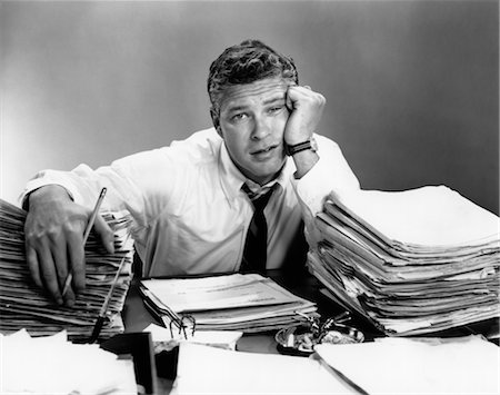 1950s PORTRAIT MAN OVERWORKED WITH DESK FULL OF PAPERS Stock Photo - Rights-Managed, Code: 846-02795767