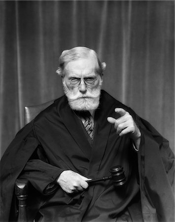 1930s STERN ELDERLY JUDGE WITH BEARD AND GLASSES POINTING AT CAMERA Stock Photo - Rights-Managed, Code: 846-02795776