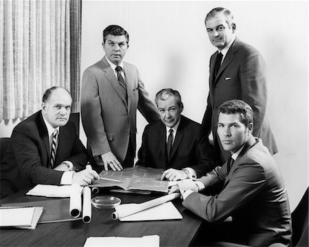 retro business meeting - 1970s FIVE MEN EXECUTIVES AROUND BUSINESS CONFERENCE TABLE LOOKING AT CAMERA Stock Photo - Rights-Managed, Code: 846-02795869