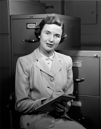 1950s WOMAN NOTES BUSINESS SECRETARY FILING CABINET SUIT Stock Photo - Rights-Managed, Code: 846-02796060