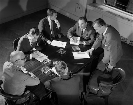 1950s SIX MEN BUSINESSMEN SALESMEN IN SUITS MEETING AROUND CONFERENCE TABLE Stock Photo - Rights-Managed, Code: 846-02796080