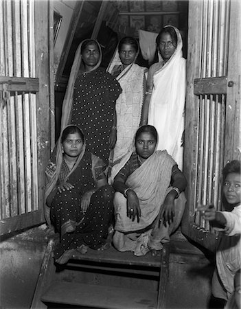 1930s LADIES OF PLEASURE GRANT ROAD BOMBAY INDIA WOMEN PROSTITUTES IN SARIS IN DOORWAY Stock Photo - Rights-Managed, Code: 846-02796272