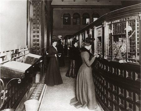 simsearch:846-02796457,k - 1890s 1900s TURN OF CENTURY BANK INTERIOR WOMEN BANKING SPECIAL TELLERS Stock Photo - Rights-Managed, Code: 846-02796464