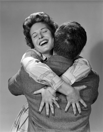 photo of a woman touching a man face - 1950s COUPLE MAN AND HAPPY WOMAN EMBRACE HUGGING Stock Photo - Rights-Managed, Code: 846-02796690
