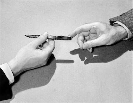 fountain pen - 1940s FOUNTAIN PEN BEING PASSED FROM ONE BUSINESSMAN'S HAND TO ANOTHER'S Stock Photo - Rights-Managed, Code: 846-02796788