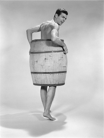 1960s ANGRY NAKED MAN WEARING BARREL Stock Photo - Rights-Managed, Code: 846-02796952