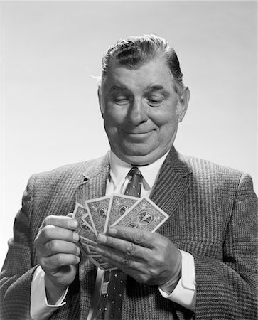 poker game - 1960s MAN SMILING LOOKING HAND OF PLAYING CARDS Stock Photo - Rights-Managed, Code: 846-02797048