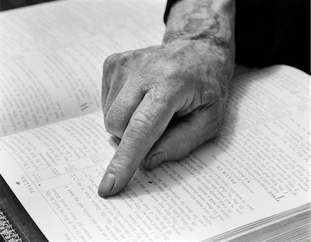 HAND OF ELDERLY PERSON FINGER FOLLOWING ALONG PASSAGE IN BOOK READ READING BIBLE PSALM RELIGION FAITH AGE INSPIRATION KNOWLEDGE Stock Photo - Rights-Managed, Code: 846-02797460