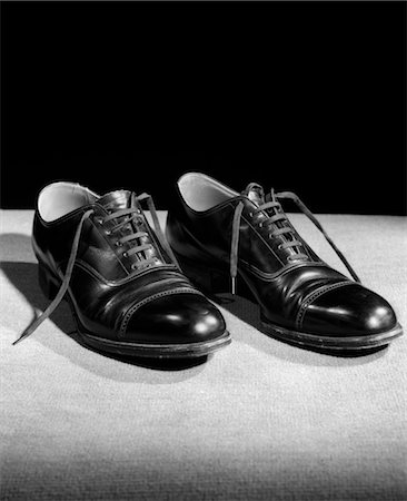 empty shoes - 1930s PAIR OF BLACK LACE UP MEN'S SHOES Stock Photo - Rights-Managed, Code: 846-02797502