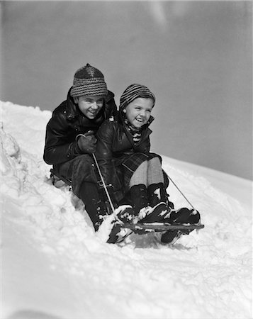 simsearch:846-02796436,k - 1930s BOY AND GIRL GOING DOWN HILL ON SLED OUTSIDE IN SNOW Stock Photo - Rights-Managed, Code: 846-02797798