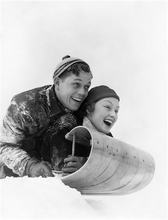 simsearch:846-02796436,k - 1930s COUPLE ON SLED LAUGHING Stock Photo - Rights-Managed, Code: 846-02797806