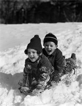 simsearch:846-02796436,k - 1930s BOY AND GIRL LAUGHING SLEDDING IN SNOW Stock Photo - Rights-Managed, Code: 846-02797831