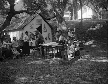 GROUP OF MEN AND WOMEN HAVING PICNIC BY LODGE Stock Photo - Rights-Managed, Code: 846-02791846