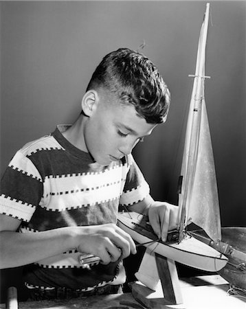 1950s BOY WORKING ON MODEL SAILBOAT Stock Photo - Rights-Managed, Code: 846-02791983