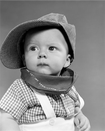 1950s BABY HEAD & SHOULDERS WEARING RAILROAD ENGINEER HAT WITH KERCHIEF AT NECK AND CHECKED SHIRT Stock Photo - Rights-Managed, Code: 846-02792045