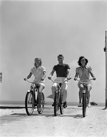 1940s MAN TWO WOMEN BIKING ON BEACH BOARDWALK Stock Photo - Rights-Managed, Code: 846-02792071